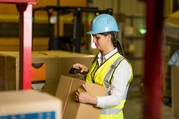 female warehouse worker checking delivering boxes. distribution center. logistics concept. 