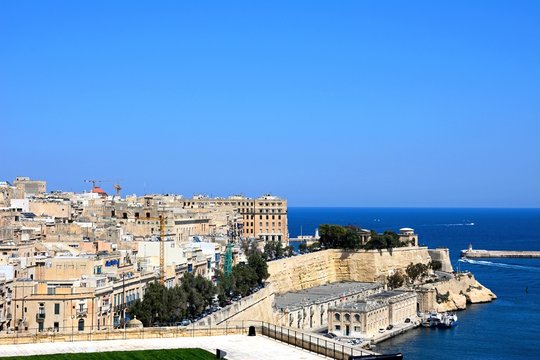 Elevated view of city buildings on the East side of the grand harbour, Valletta, Malta.