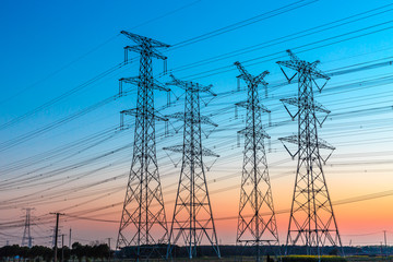 high voltage post,High voltage tower sky sunset background