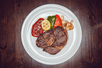 Grilled steak and vegetables on a plate.