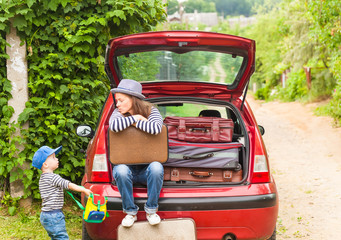 Girl happy child travel suitcases car summer landscape