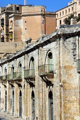Fototapeta na wymiar Traditional buildings with balconies near the waterfront, Valletta, Malta.