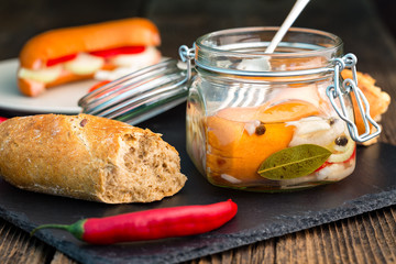 Traditional Czech sausages  in vinegar with onion