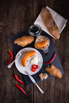 Traditional Czech sausages  in vinegar with onion