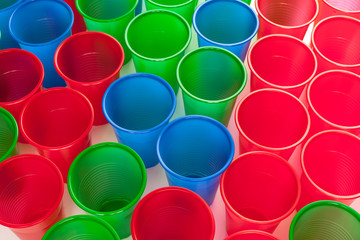 Multicolor plastic glasses isolated on white background