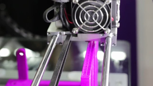 3D printer inject colorful plastic part for prototype in an manufacturing exhibition.