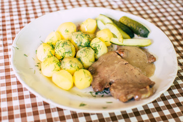 Beef with potatoes and cucumbers