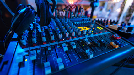 Professional audio mixing console with fader and adjusting knobs - radio / TV broadcasting that...