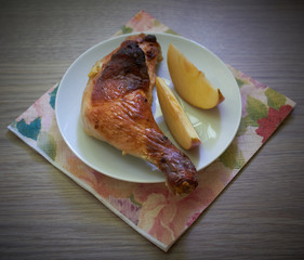 Chicken leg and apple