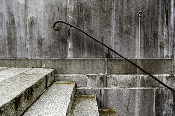 Old dirty stairs with railing