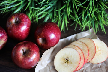 Red fresh apple on a wooden table