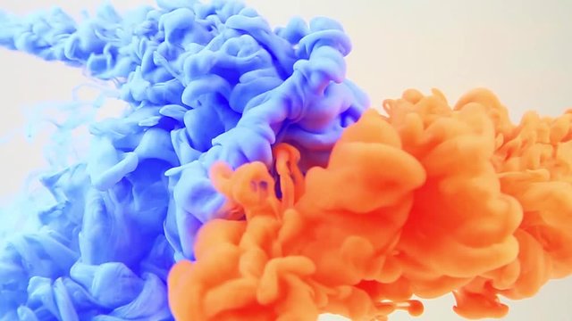 hd video of color ink in water. slow motion