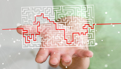 Businessman searching solution of a complicated maze