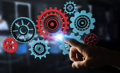 Businessman touching floating gear icons in his hand 3D rendering