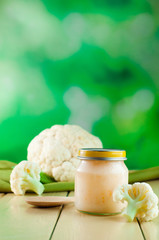 Natural broccoli baby food on the wooden background