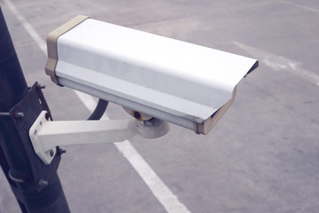 security CCTV camera in car park, filter effect
