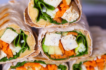 Healthy vegan tofu tortilla wraps with tofu and vegetables. Love for a healthy raw food concept.