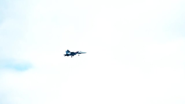 Modern Russian fighter performing landing descent. Slow motion shot