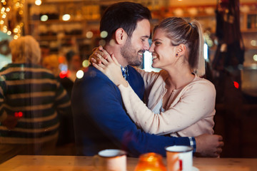 Young attractive couple on date in bar