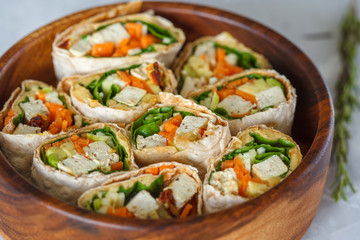 Healthy vegan tofu tortilla wraps with tofu and vegetables. Love for a healthy raw food concept.