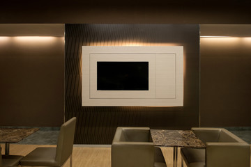 Close up detail of lounge - built in television in wall.