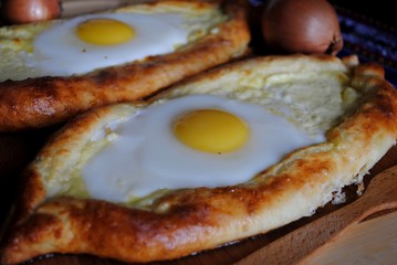 Khachapuri in Adjara with the egg. The Georgian cuisine.