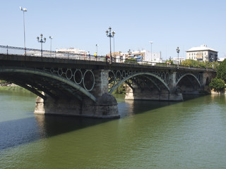 Naklejka na ściany i meble Puente de Triana. Río Guadalquivir / Bridge of Triana. Guadalquivir river. Sevilla