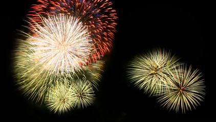Fototapeta premium Abstract fireworks light up in the sky at night