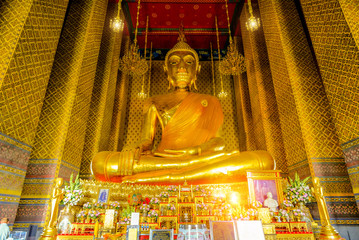Fototapeta premium The Principal Golden Buddha statue in the chapel of Wat Kalayanamit temple. Main temple of thailand