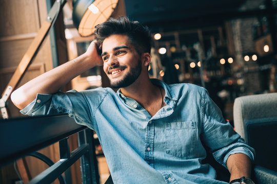 Portrait of young handsome man in blue shirt