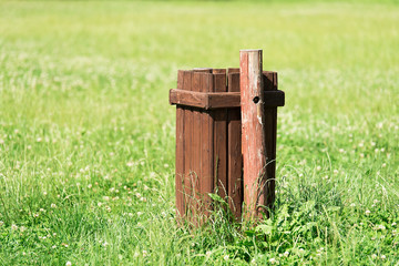 Wooden dustbin in the park