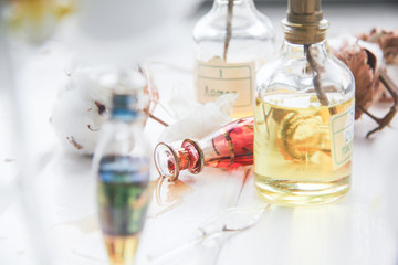 perfume and flowers cotton and white Orchid on white wooden table