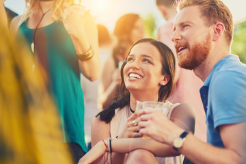 Couple flirting at outdoor party