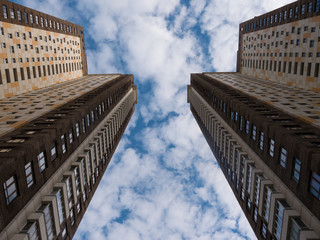 Two modern high building view from bottom with blue sky background