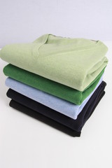 many colorful sweaters in a row..Still life of clothes, stack of sweater