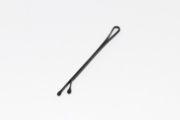 Small black metal hairpin isolated on white, hair pin silhouette