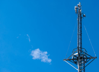 Mobile tower on a background of blue sky.