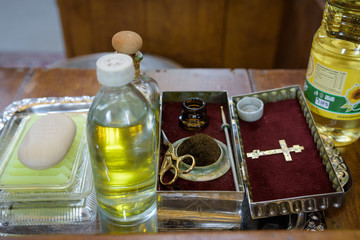 church utensils at the altar, glans,ceremony of water baptism, various objects needed for baptism christening - oil, soap, scissors