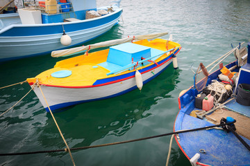 Fototapeta na wymiar Colorful Greek fishing boats in port of Kardamena in Kos island, Greece.