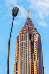The skyscraper and a streetlight on the background of cloudy sky, Atlanta, USA