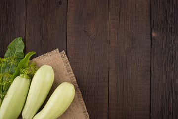Courgettes on an old wooden table.
