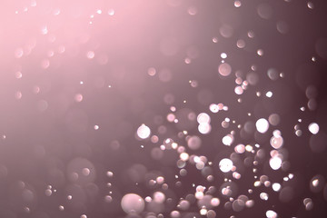 Beautiful and blurry bokeh on a pink background.