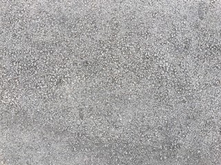 The texture of fresh asphalt lined up close