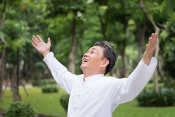 healthy, happy, positive, smiling asian senior man looking up