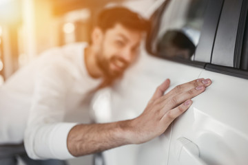 Man in car dealership
