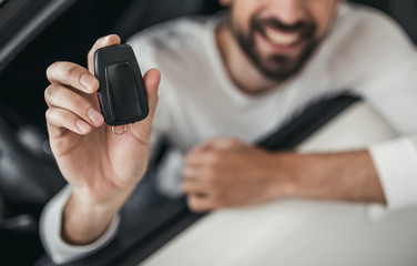 Man in car dealership