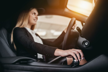 Businesswoman at car dealership