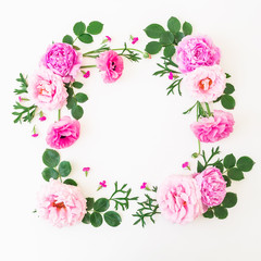 Frame made of pink flowers - roses and peonies with leaves on white background. Floral composition. Flat lay, top view.