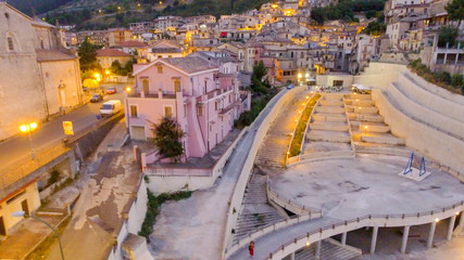 Naklejka premium Stilo, Calabria. Aerial view of ancient medieval homes at sunset, Italy