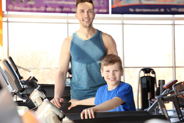 Fototapeta na wymiar Dad and son in gym